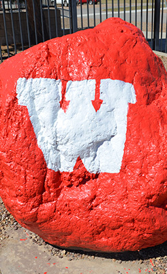 Spirit Rock: large rock painted red with a white "W" on it